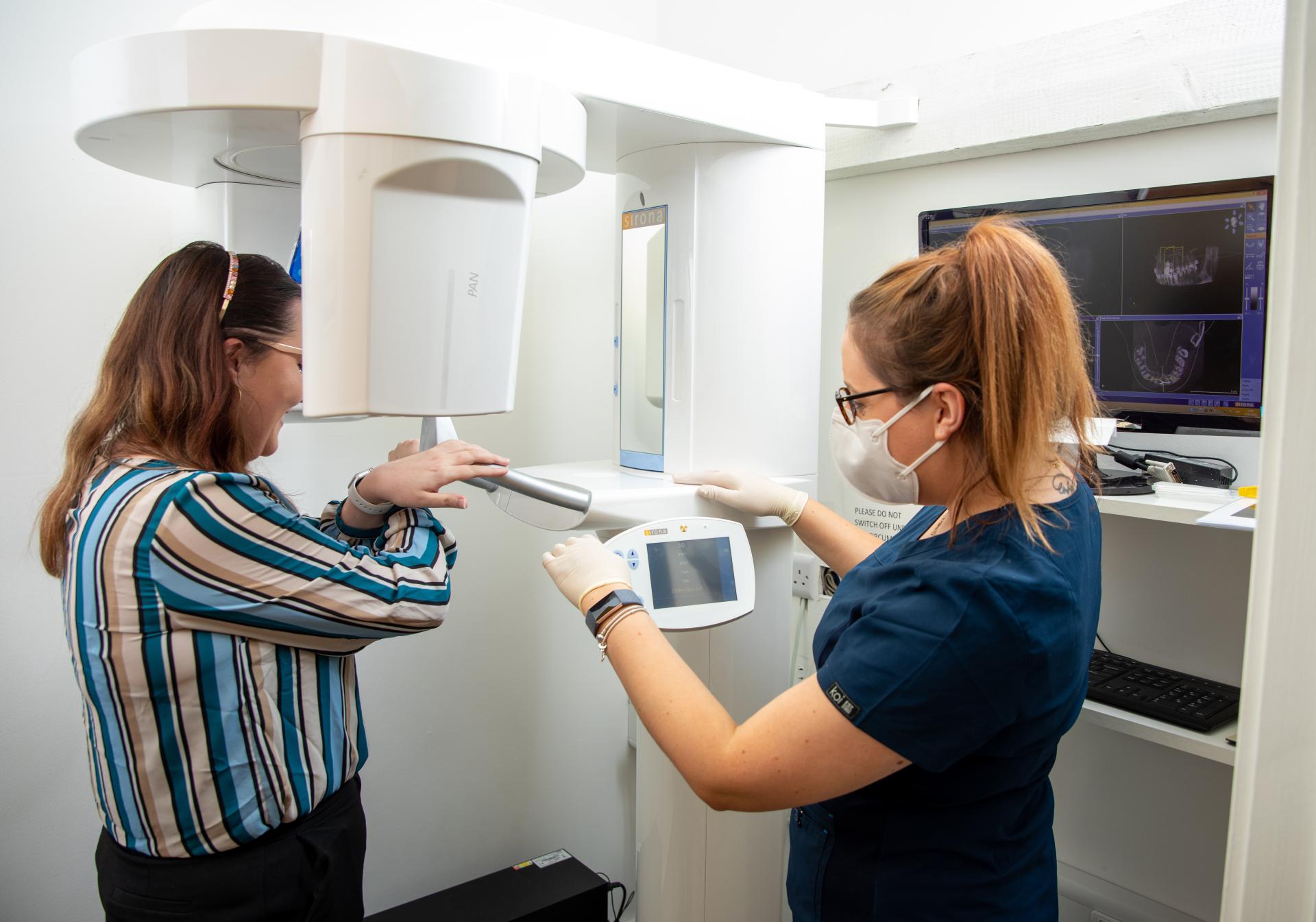 Nurse taking scan of patient