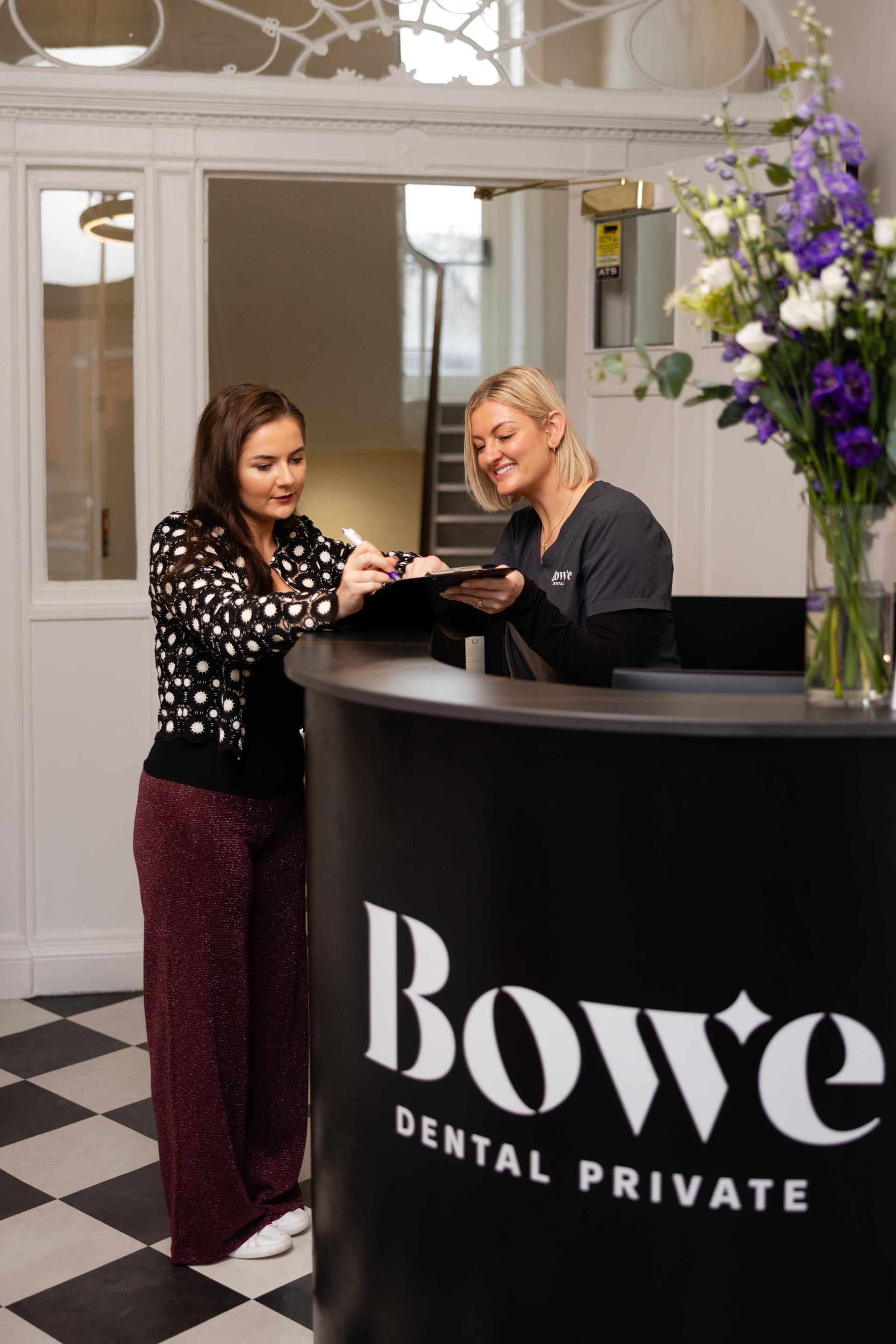 Receptionist with patient